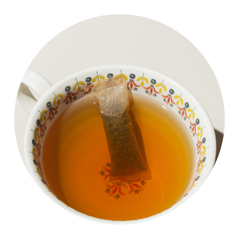 teacup with tea bag back oolong tea